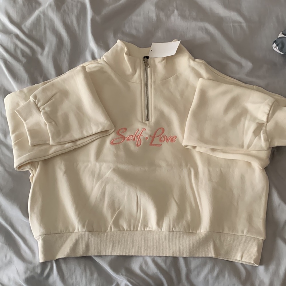 "self love" embroidered cream long sleeve croppped